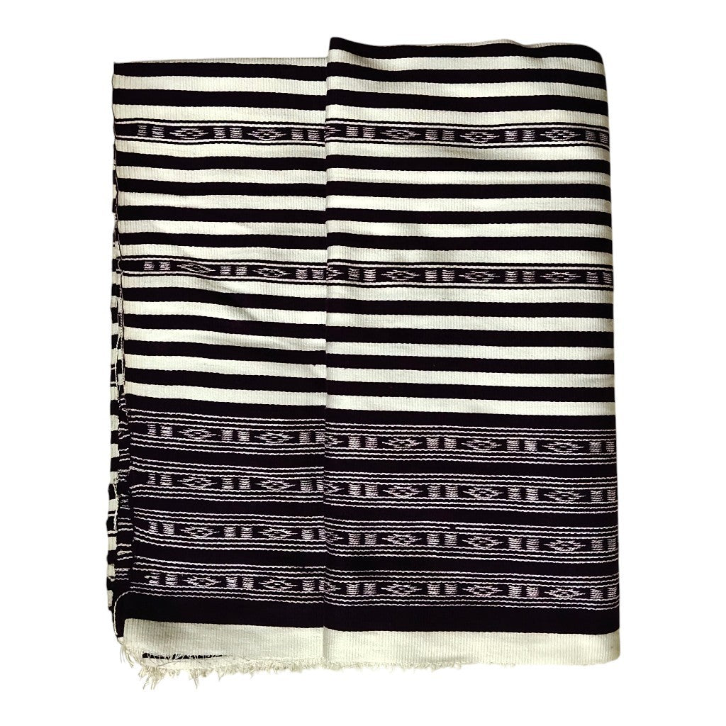 Honnihonjeng handwoven textile fabric featuring a monochrome black and white striped design with geometric patterns.