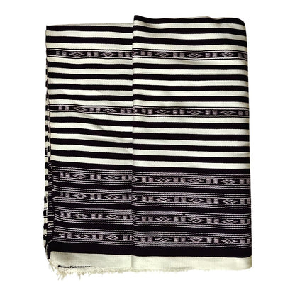 Honnihonjeng handwoven textile fabric featuring a monochrome black and white striped design with geometric patterns.