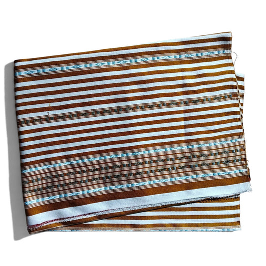 Honnihonjeng handwoven fabric featuring brown and white stripes with intricate turquoise geometric woven patterns.