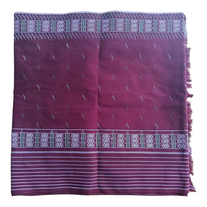 Honnihonjeng handwoven burgundy textile wrap featuring intricate geometric patterns, white linear accents, and fringe.