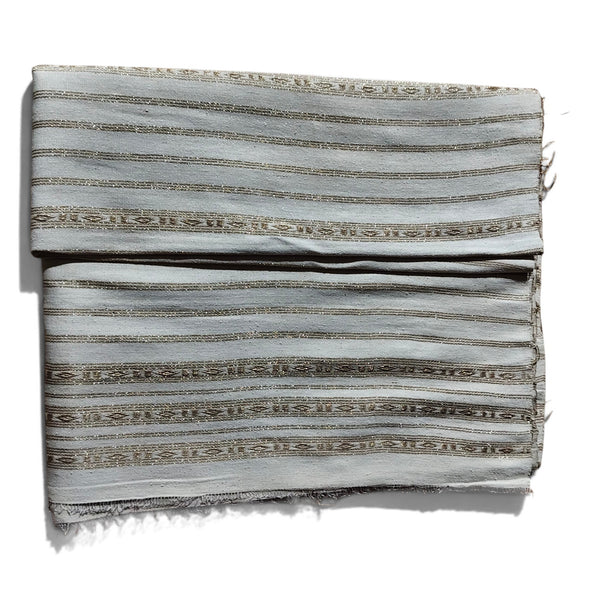 Honnihonjeng handwoven fabric in light grey with intricate metallic gold striped patterns and textured weave.