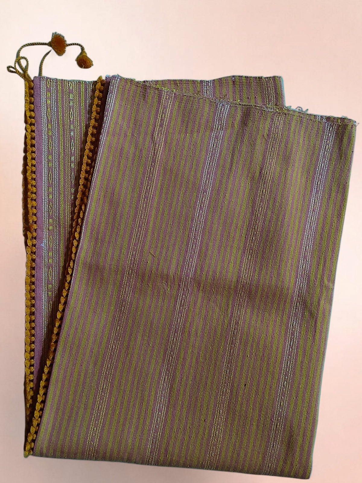 Honnihonjeng Pekok Honki hand-woven Eri silk fabric with gold and silver metallic stripes and decorative pom-pom trim