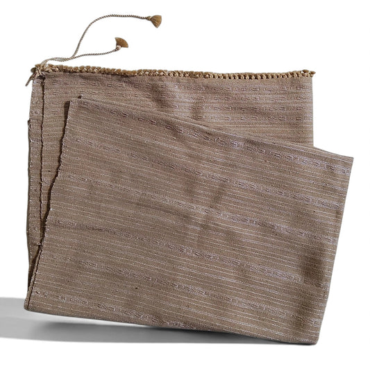 Honnihonjeng Pekok Toss Muga silk fabric in golden beige with delicate zari stripes and decorative tassel trim