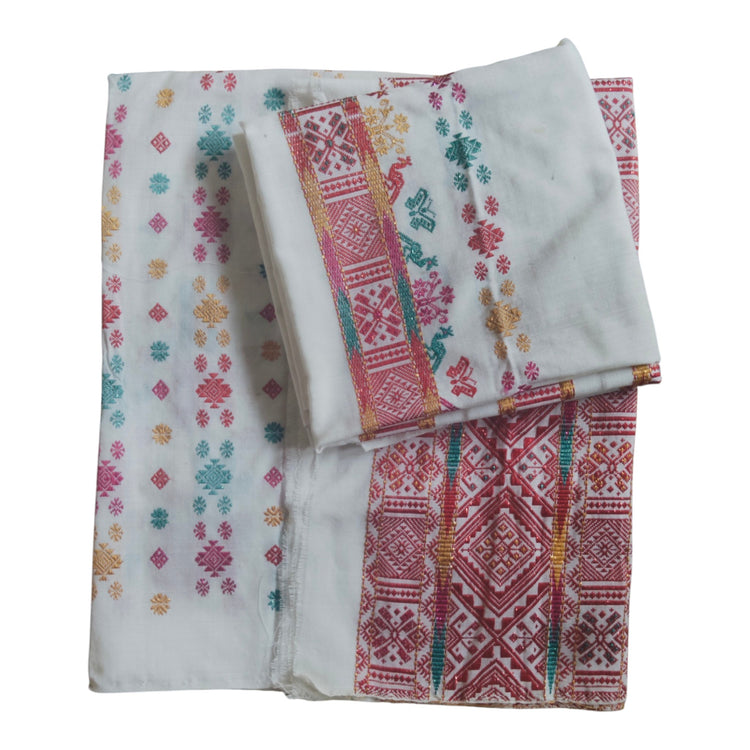 Honnihonjeng traditional white cotton Mekhela Chador set with vibrant red, green, and gold geometric floral embroidery.